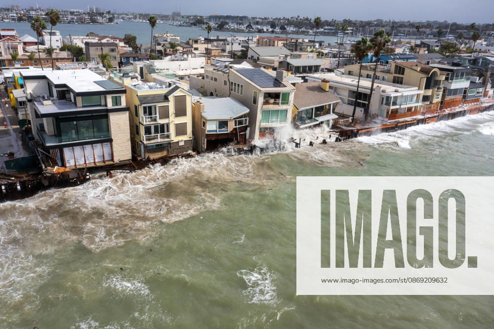 The Long Beach Peninsula is facing severe, structural devastation as Tropical Storm Rachel batters the Southern California coast. Driven by a developing El Nino pattern, this is the fourth major storm system to slam the shoreline in six weeks. Waves and unusually high tides have shattered a 30-foot section of the protective wooden bulkhead, completely shredding the historic boardwalk and allowing seawater to surge directly onto interior streets. Flooding has swamped coastal neighborhoods, forcing mandatory evacuations along oceanfront blocks like Seaside Walk. Emergency crews are working to stack thousands of sandbags and reinforce coastal defenses, but city inspectors have already been forced - ZUMAr19_ 20261011_new_r19_138