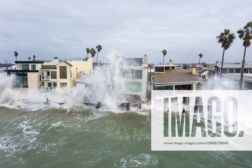 The Long Beach Peninsula is facing severe, structural devastation as Tropical Storm Rachel batters the Southern California coast. Driven by a developing El Nino pattern, this is the fourth major storm system to slam the shoreline in six weeks. Waves and unusually high tides have shattered a 30-foot section of the protective wooden bulkhead, completely shredding the historic boardwalk and allowing seawater to surge directly onto interior streets. Flooding has swamped coastal neighborhoods, forcing mandatory evacuations along oceanfront blocks like Seaside Walk. Emergency crews are working to stack thousands of sandbags and reinforce coastal defenses, but city inspectors have already been forced - ZUMAr19_ 20261011_new_r19_145