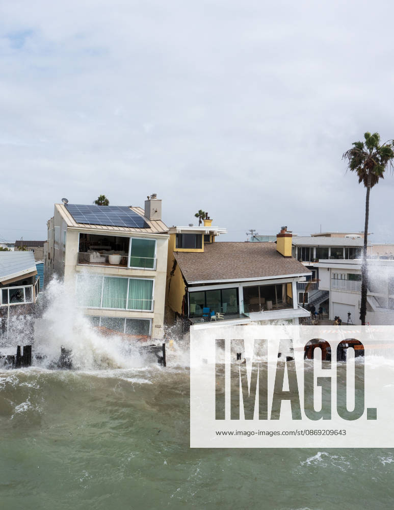 The Long Beach Peninsula is facing severe, structural devastation as Tropical Storm Rachel batters the Southern California coast. Driven by a developing El Nino pattern, this is the fourth major storm system to slam the shoreline in six weeks. Waves and unusually high tides have shattered a 30-foot section of the protective wooden bulkhead, completely shredding the historic boardwalk and allowing seawater to surge directly onto interior streets. Flooding has swamped coastal neighborhoods, forcing mandatory evacuations along oceanfront blocks like Seaside Walk. Emergency crews are working to stack thousands of sandbags and reinforce coastal defenses, but city inspectors have already been forced - ZUMAr19_ 20261011_new_r19_148