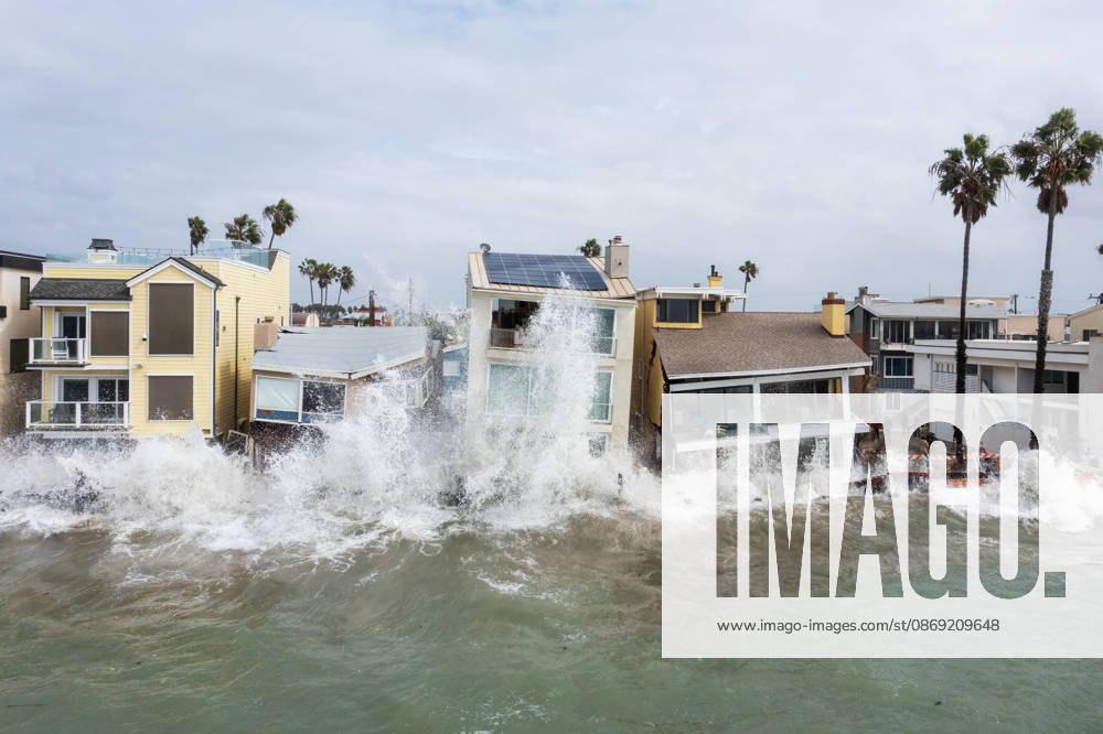 The Long Beach Peninsula is facing severe, structural devastation as Tropical Storm Rachel batters the Southern California coast. Driven by a developing El Nino pattern, this is the fourth major storm system to slam the shoreline in six weeks. Waves and unusually high tides have shattered a 30-foot section of the protective wooden bulkhead, completely shredding the historic boardwalk and allowing seawater to surge directly onto interior streets. Flooding has swamped coastal neighborhoods, forcing mandatory evacuations along oceanfront blocks like Seaside Walk. Emergency crews are working to stack thousands of sandbags and reinforce coastal defenses, but city inspectors have already been forced - ZUMAr19_ 20261011_new_r19_147