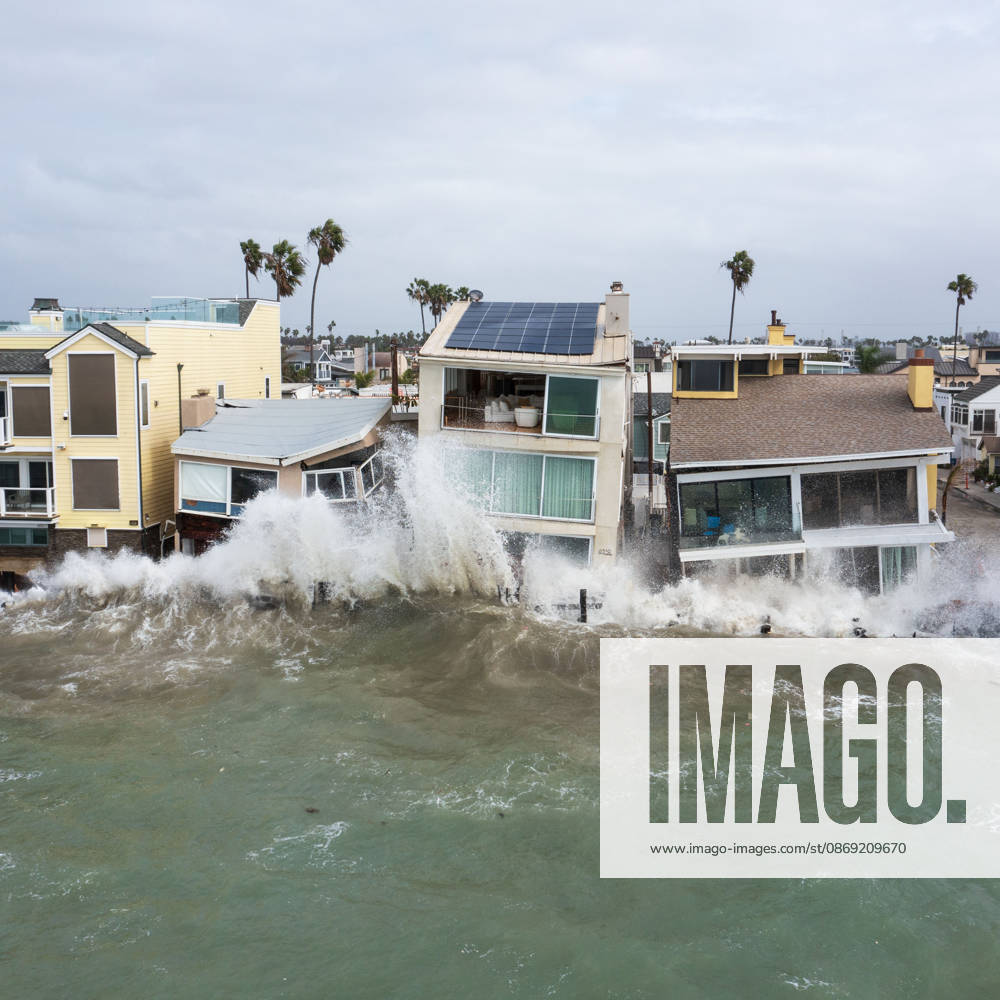 The Long Beach Peninsula is facing severe, structural devastation as Tropical Storm Rachel batters the Southern California coast. Driven by a developing El Nino pattern, this is the fourth major storm system to slam the shoreline in six weeks. Waves and unusually high tides have shattered a 30-foot section of the protective wooden bulkhead, completely shredding the historic boardwalk and allowing seawater to surge directly onto interior streets. Flooding has swamped coastal neighborhoods, forcing mandatory evacuations along oceanfront blocks like Seaside Walk. Emergency crews are working to stack thousands of sandbags and reinforce coastal defenses, but city inspectors have already been forced - ZUMAr19_ 20261011_new_r19_142