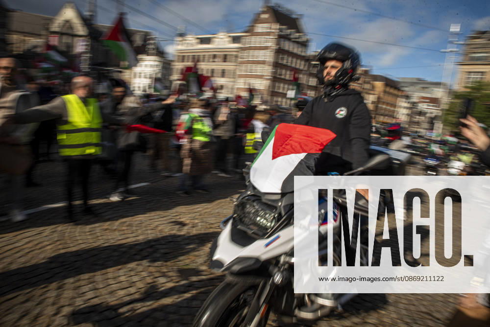 Amsterdam, North Holland, The Netherlands - Holland: 11 October 2026, Amsterdam, the Netherlands: The group Bikers for Palestine departs from Dam Square. Protesters gathered at Dam Square for speeches and anti-war music before marching through AmsterdamÃ¢â‚¬â ¢s city centre in a demonstration dubbed Ã¢â‚¬oeThree Years of GenocideÃ¢â‚¬Â. The event marked three years since the start of the IsraelÃ¢â‚¬Hamas war. Demonstrators carried Palestinian flags and banners, demanding the Dutch government act against what they describe as a genocide in Gaza. Amsterdam The Netherlands - Holland - ZUMAp202 20261011_zip_p202_008