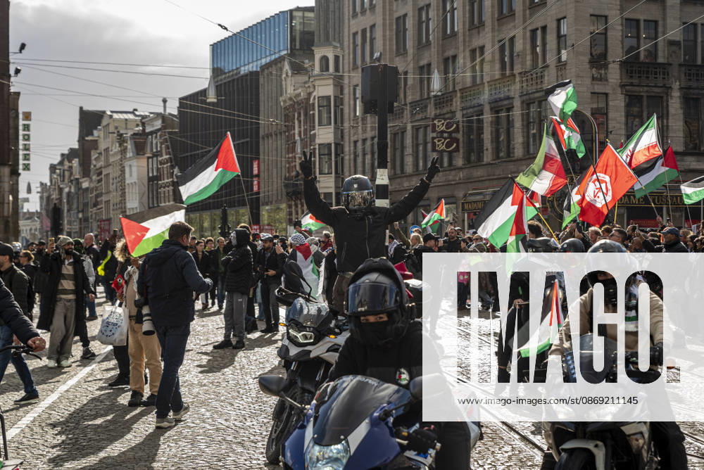 Amsterdam, North Holland, The Netherlands - Holland: 11 October 2026, Amsterdam, the Netherlands: The group Bikers for Palestine arrives to Dam Square. Protesters gathered at Dam Square for speeches and anti-war music before marching through AmsterdamÃ¢â‚¬â ¢s city centre in a demonstration dubbed Ã¢â‚¬oeThree Years of GenocideÃ¢â‚¬Â. The event marked three years since the start of the IsraelÃ¢â‚¬Hamas war. Demonstrators carried Palestinian flags and banners, demanding the Dutch government act against what they describe as a genocide in Gaza. Amsterdam The Netherlands - Holland - ZUMAp202 20261011_zip_p202_013