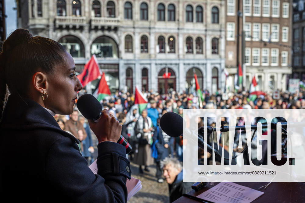 Amsterdam, North Holland, The Netherlands - Holland: 11 October 2026, Amsterdam, the Netherlands: A speaker addresses hundreds of pro-Palestinian protesters gathered at Dam Square. Following more speeches and anti-war music, they marched through AmsterdamÃ¢â‚¬â ¢s city centre in a demonstration dubbed Ã¢â‚¬oeThree Years of GenocideÃ¢â‚¬Â. The event marked three years since the start of the IsraelÃ¢â‚¬Hamas war. Demonstrators carried Palestinian flags and banners, demanding the Dutch government act against what they describe as a genocide in Gaza. Amsterdam The Netherlands - Holland - ZUMAp202 20261011_zip_p202_027