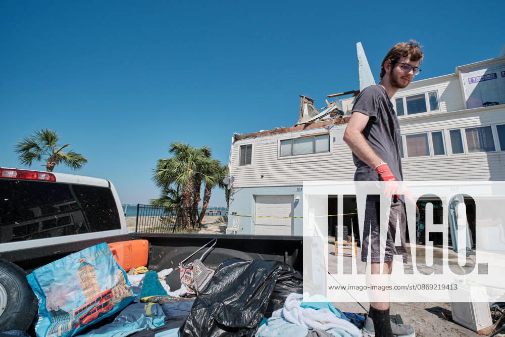 Pensacola Beach, Florida, U.S: October 11, 2026 Pensacola Beach, Florida USA: Alex Dean loads up the back of his truck with belonging from his storm damaged apartment complex after the arrival of Hurricane Isaias. Pensacola Beach U.S - ZUMAa14_ 20261011_zaf_a14_012