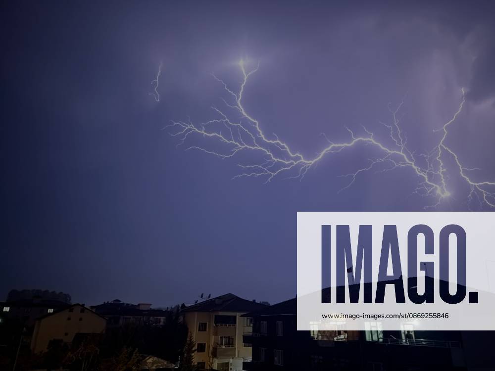 Lightning illuminates night sky during heavy rain in Duzce DUZCE, TURKIYE - OCTOBER 12: Lightning streaks across the sky over Duzce as heavy rain affects the city during the evening hours, on October 12, 2026 in Duzce, Turkiye. Ömer Ürer Anadolu Düzce Turkey. Editorial use only. Please get in touch for any other usage.