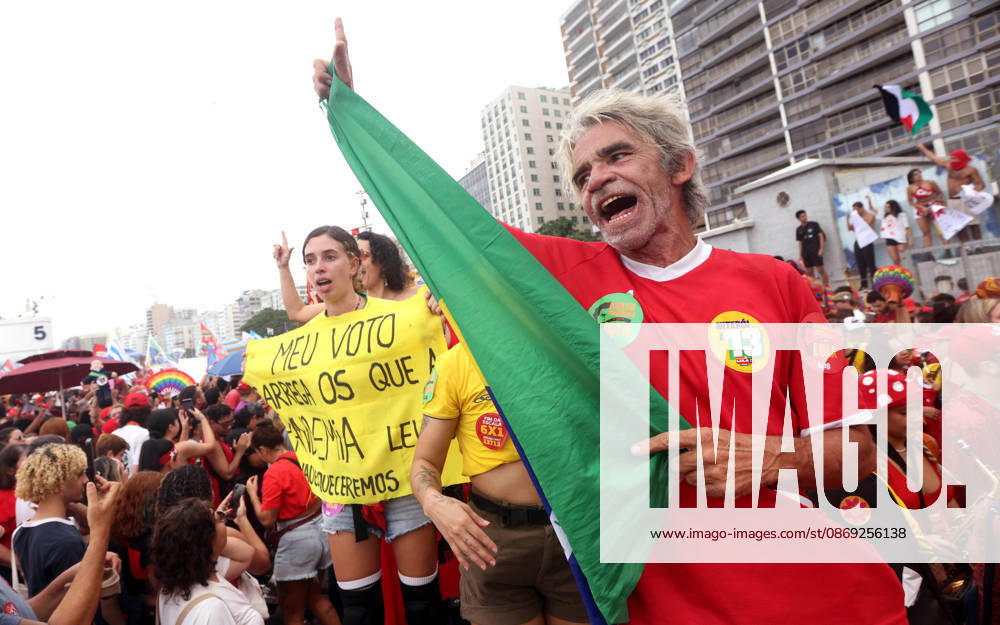 Thousands of supporters gather in Copacabana, Rio de Janeiro, Brazil, on October 12, 2026, for a pro-democracy demonstration organized by the CENA Nacional movement, the National Union of Students (UNE) and Universibloco. Held on BrazilÃ¢â‚¬â ¢s Our Lady of Aparecida national holiday, the rally calls for the defense of constitutional rights and public policies supporting healthcare, education and social assistance. Carnival street bands, known as blocos, and percussion groups brought music and a festive atmosphere to the waterfront mobilization, blending political activism with RioÃ¢â‚¬â ¢s popular street culture. The demonstration takes place ahead of BrazilÃ¢â‚¬â ¢s October 25 pres - ZUMAk251 20261012_znp_k251_029