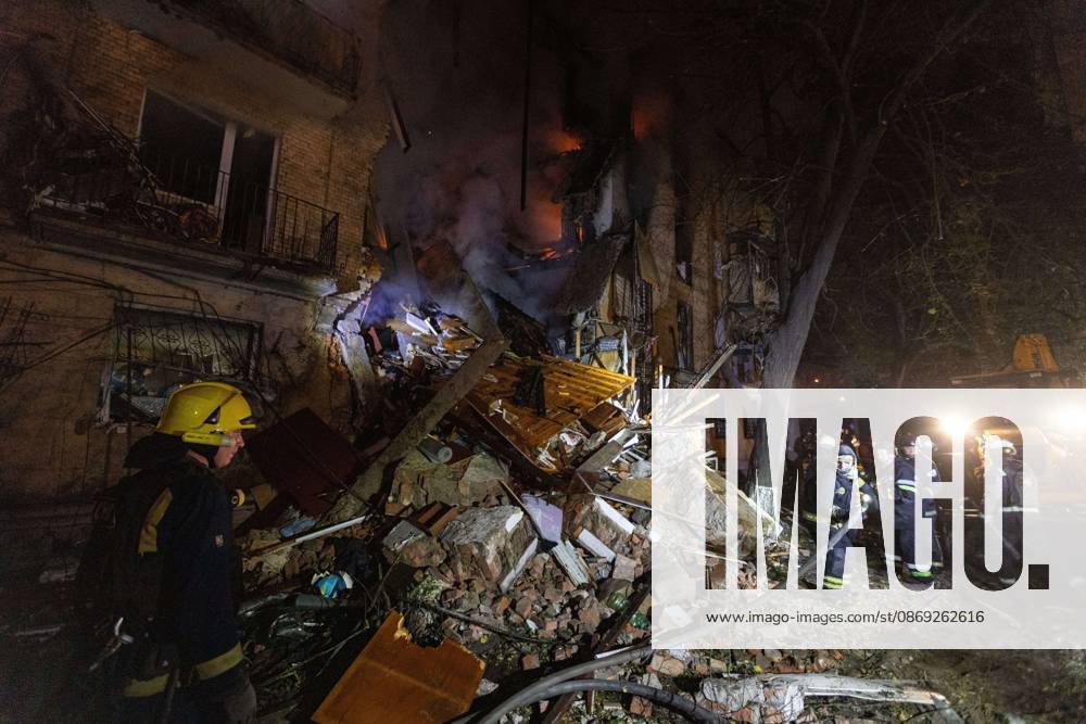 KHARKIV, UKRAINE, OCTOBER 12, 2026: Emergency workers conduct rescue operations at a residential building damaged in a Russian strike in Kharkiv s Kholodnohirskyi district. A firefighter was injured by falling concrete debris while clearing the rubble and was evacuated on a stretcher. Kharkiv Ukraine - ZUMAq101 20261012_zna_q101_139