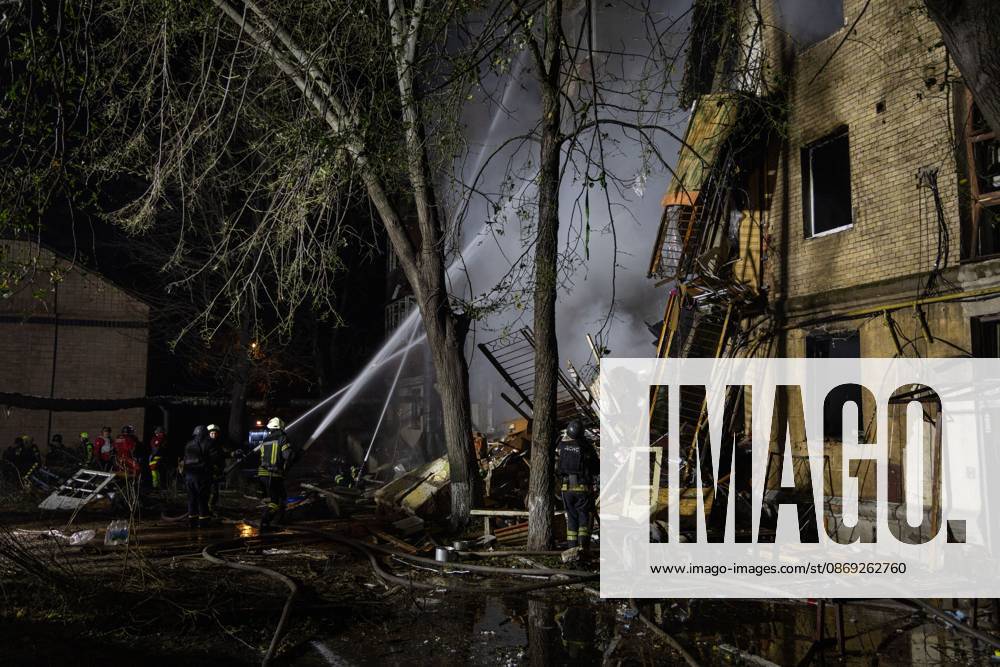 KHARKIV, UKRAINE, OCTOBER 12, 2026: Emergency workers conduct rescue operations at a residential building damaged in a Russian strike in Kharkiv s Kholodnohirskyi district. A firefighter was injured by falling concrete debris while clearing the rubble and was evacuated on a stretcher. Kharkiv Ukraine - ZUMAq101 20261013_zna_q101_003
