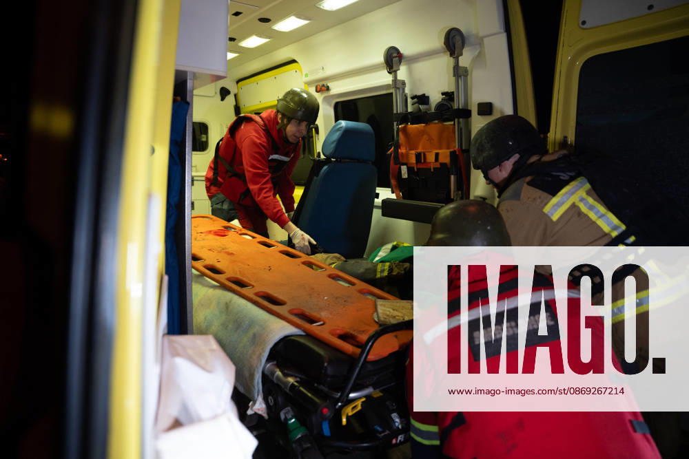 Rescuers load an injured firefighter into an ambulance after a sustained injury clearing debris at a Russian cruise missile strike on a residential area in Kharkiv, Ukraine, 2026. Kharkiv Ukraine - ZUMAm350 20261012_zip_m350_004