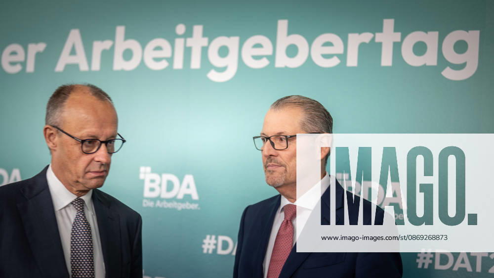 Chancellor Friedrich Merz is welcomed by Rainer Dulger, President of the Confederation of German Employers Associations (BDA), at the start of the 2026 German Employers Day, hosted by the Confederation of German Employers Associations (BDA), Berlin, Germany, at the Berlin Congress Center (bcc)