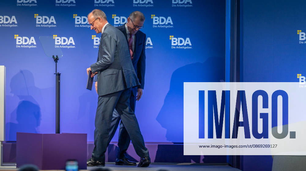 Chancellor Friedrich Merz is welcomed by Rainer Dulger, President of the Confederation of German Employers Associations (BDA), at the start of the 2026 German Employers Day, hosted by the Confederation of German Employers Associations (BDA), Berlin, Germany, at the Berlin Congress Center (bcc)