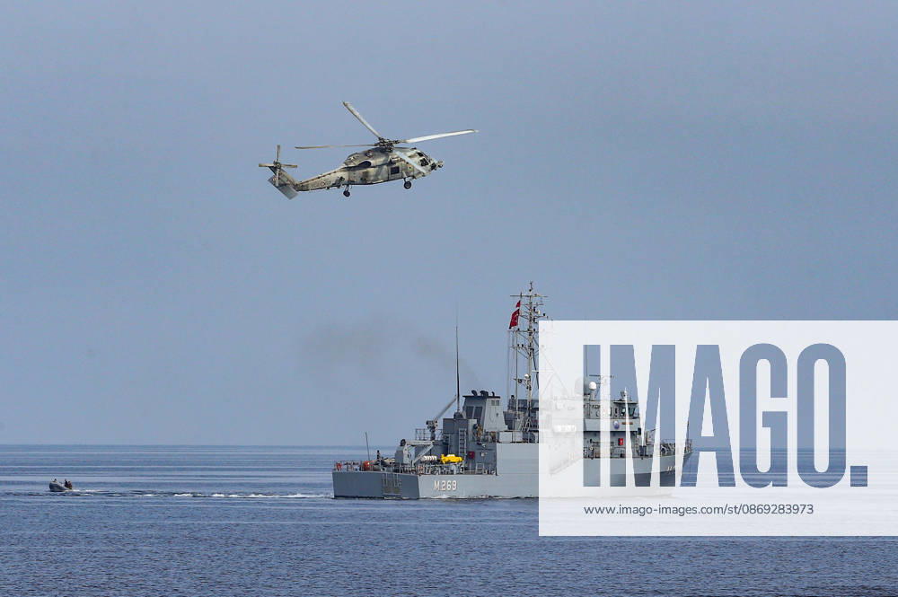 NUSRET-2026 Invitational Exercise continues in Turkiye s Izmir IZMIR, TURKIYE - OCTOBER 13: A military helicopter flies over a naval vessel during Distinguished Observer Day activities held off the coast of Foca district in Izmir, Turkiye, on October 13, 2026, as part of the NUSRET-2026 Invitational Exercise. Hosted by Turkiye and conducted by the Turkish Naval Forces Mine Fleet Command, the exercise continues in the Gulf of Izmir and off Karadeniz Eregli, with the participation of naval, air and coast guard assets from NATO and Turkiye, along with observers from various countries. Mahmut Serdar Alakus Anadolu Izmir Turkey. Editorial use only. Please get in touch for any other usage.