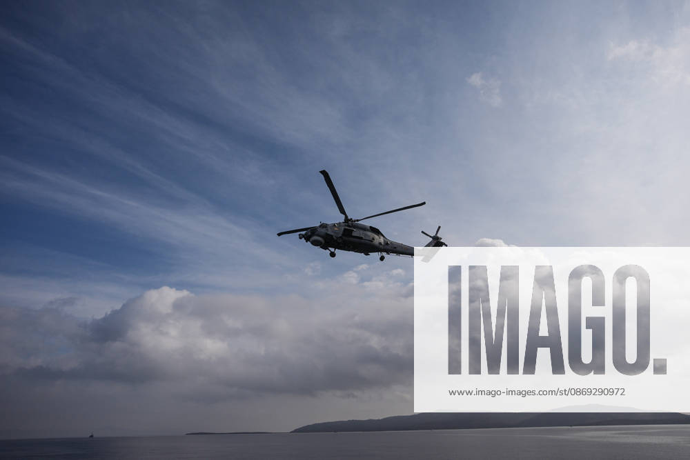 NUSRET-2026 Invitational Exercise continues in Turkiye s Izmir IZMIR, TURKIYE - OCTOBER 13: A military helicopter flies during Distinguished Observer Day activities held off the coast of Foca district in Izmir, Turkiye, on October 13, 2026, as part of the NUSRET-2026 Invitational Exercise. Hosted by Turkiye and conducted by the Turkish Naval Forces Mine Fleet Command, the exercise continues in the Gulf of Izmir and off Karadeniz Eregli, with the participation of naval, air and coast guard assets from NATO and Turkiye, along with observers from various countries. Mahmut Serdar Alakus Anadolu Izmir Turkey. Editorial use only. Please get in touch for any other usage.