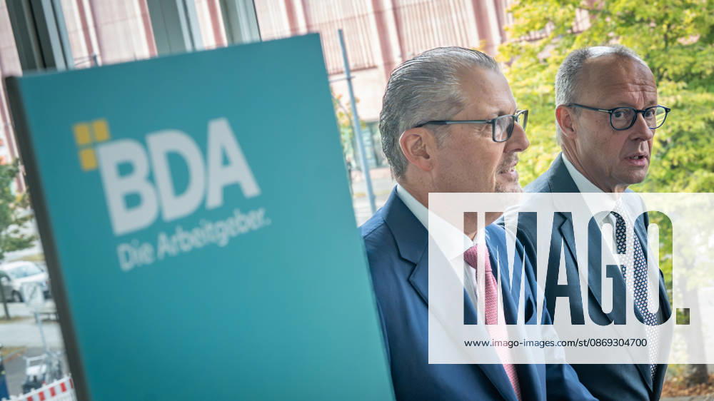 Chancellor Friedrich Merz is welcomed by Rainer Dulger, President of the Confederation of German Employers Associations (BDA), at the start of the 2026 German Employers Day, hosted by the Confederation of German Employers Associations (BDA), Berlin, Germany, at the Berlin Congress Center (bcc)