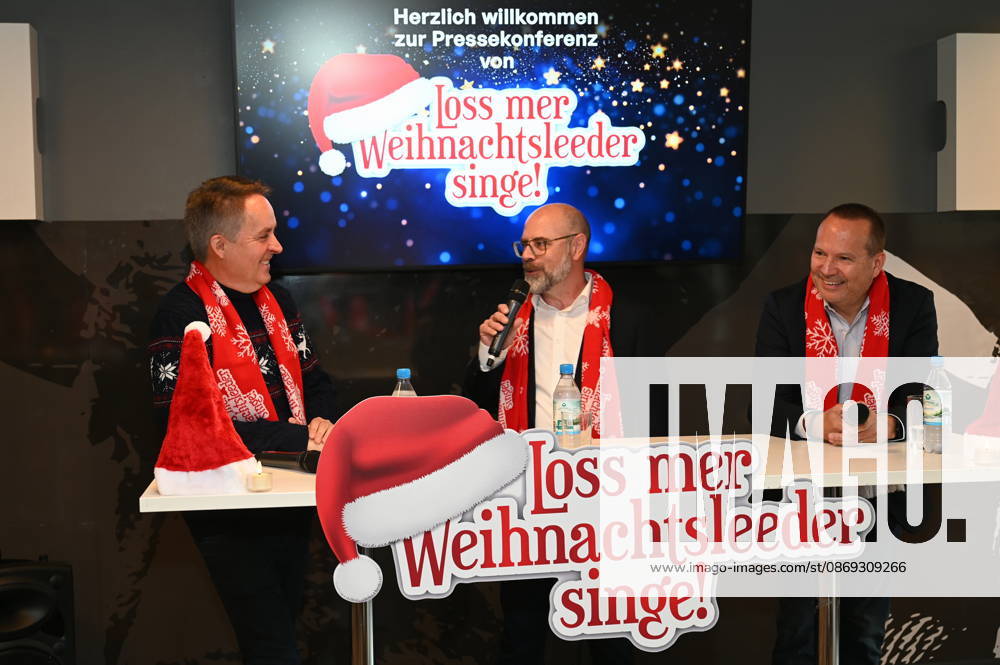 Choir director Michael Kokott, Managing Director of Kölner Sportstätten Lutz Wingerath, and Managing Director of KSta Medien Events Ralph Steinhausen, from left to right, at the RheinEnergie Stadium during the press conference for the Loss mer Weihnachtsleeder singe ( Let’s Sing Christmas Carols ) sing-along concert, which will take place this year on December 2