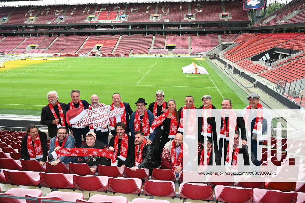 Members of the performing bands and musicians pose at the RheinEnergie Stadium during the press conference for the 10th annual Loss mer Weihnachtsleeder singe ( Let’s Sing Christmas Carols ) sing-along concert, which will take place this year on December 22 and 23, 2026, at the RheinEnergie Stadium in Cologne and is expected to draw over 90,000 fans