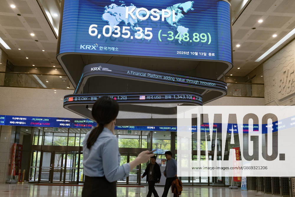South Korea Stocks Plunge As KOSPI Drops Sharply At KRX In Seoul A Korea Exchange (KRX) employee looks up at the electronic board displaying the closing KOSPI index at 6,035.35 (-348.89) in Yeouido, Seoul, South Korea, on October 13, 2026. Seoul Seoul South Korea