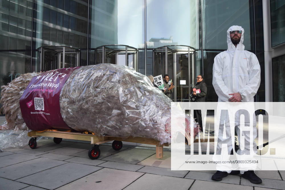 An activist stands next to a giant wrapped chicken outside Pret headquarters during a protest urging the fast food chain to drop Frankenchickens. Frankenchickens are chickens mostly raised on factory farms who are bred to grow much faster and who are said to suffer far more than regular chickens. London United Kingdom - ZUMAv130 20261013_zip_v130_039