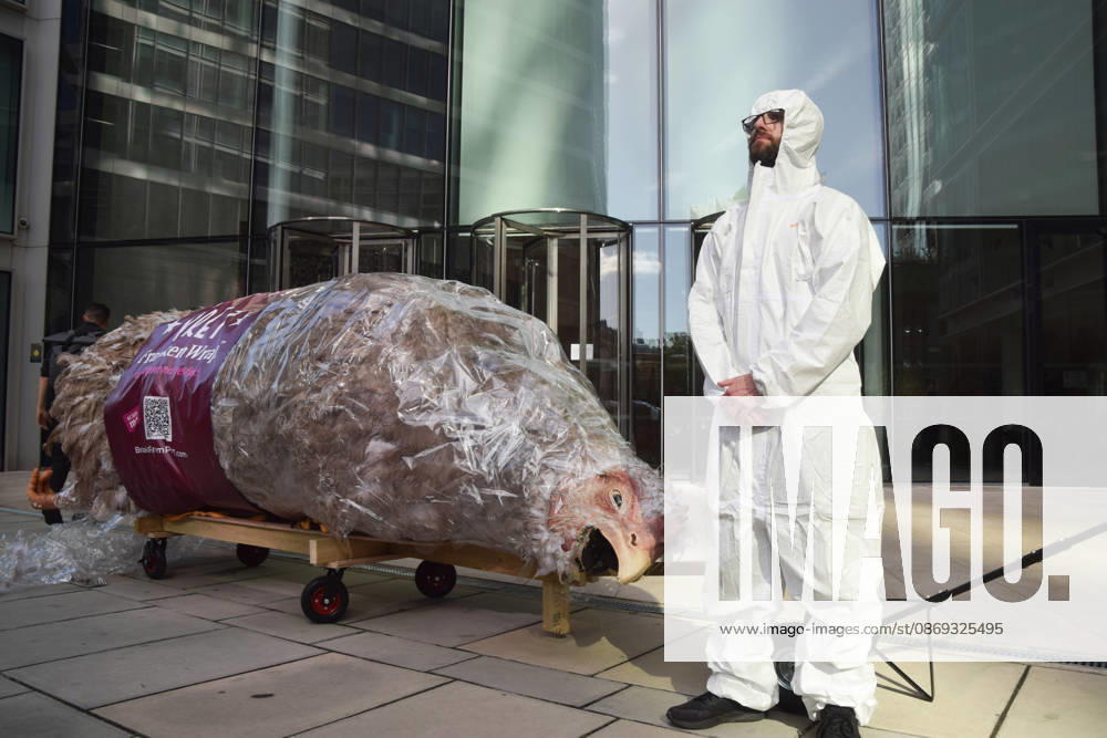 An activist stands next to a giant wrapped chicken outside Pret headquarters during a protest urging the fast food chain to drop Frankenchickens. Frankenchickens are chickens mostly raised on factory farms who are bred to grow much faster and who are said to suffer far more than regular chickens. London United Kingdom - ZUMAv130 20261013_zip_v130_040