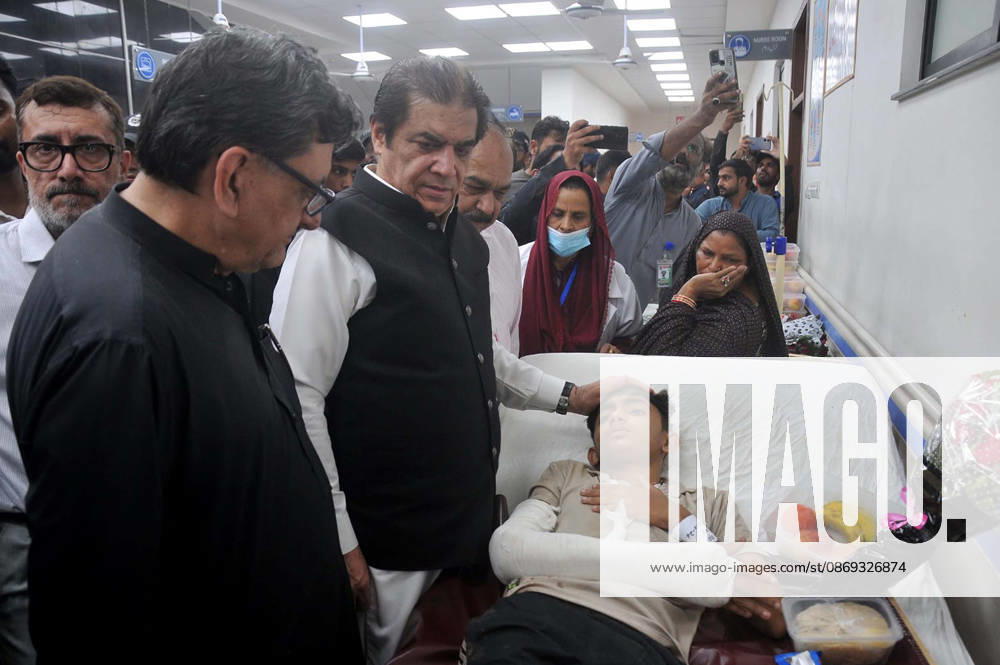 Federal Minister for Railways, Muhammad Hanif Abbasi inquires about the health of an injured passenger during his visit to the Nishtar Hospital following the derailment of the Rehman Baba Express near Sher Shah Railway Station, in Multan on Tuesday, October 13, 2026. (PPI Images).