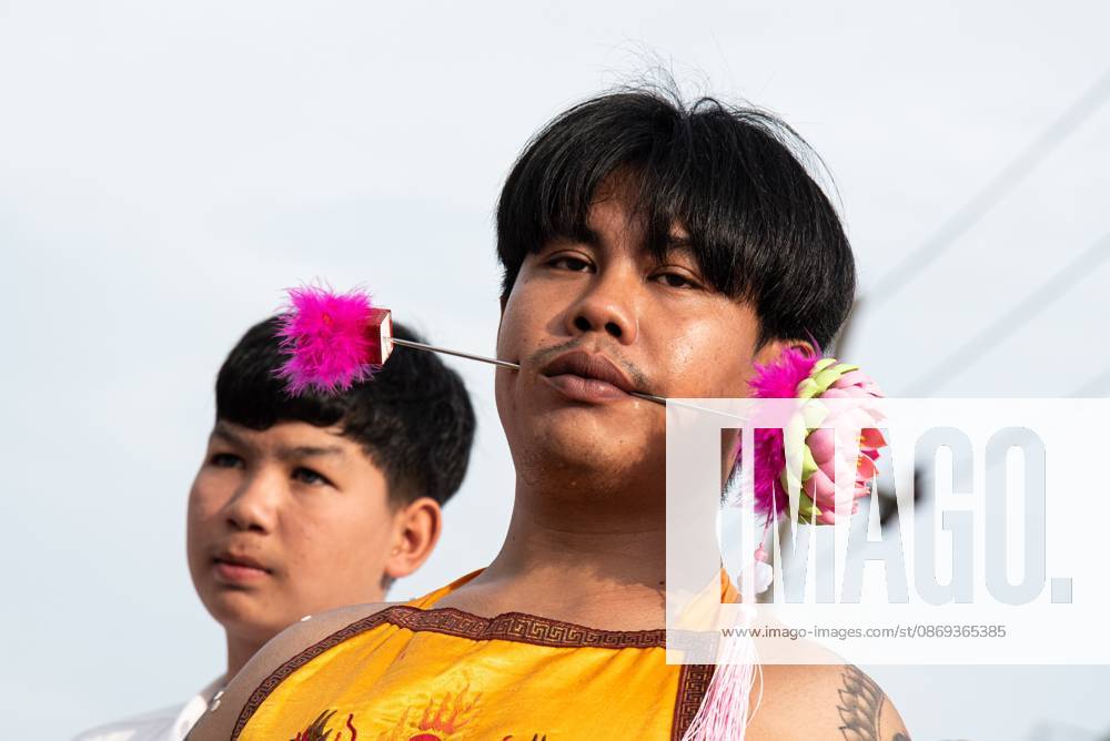 The vegetarian festival in Trang, Thailand. – 13 Oct 2026 A devotee with a skewer piercing her cheek participates in a street procession during the Vegetarian Festival. The annual Vegetarian Festival is held in Bangkok and many parts of southern Thailand, including Trang, Phatthalung, and Phuket, where worshippers refrain from eating animal products over the nine days, coinciding with the celebration of the Nine Emperor Gods. Trang Thailand