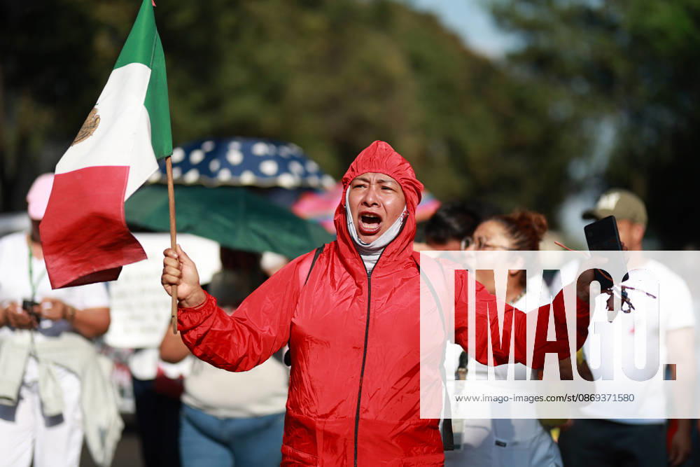 Thousands of healthcare workers hold national protest in Mexico City MEXICO CITY, MEXICO - OCTOBER 13: A woman takes part in a national protest march demanding wage increases for healthcare workers and more medical supplies for Mexico s public health system, in Mexico City, Mexico on October 13, 2026. Thousands of members of the Mexican Social Security Institute (IMSS) marched to demand higher wages, improved working conditions, and action to address nationwide shortages of basic medicines and supplies across public hospitals. Daniel Cardenas Anadolu Mexico City Mexico. Editorial use only. Please get in touch for any other usage.