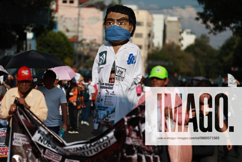 Thousands of healthcare workers hold national protest in Mexico City MEXICO CITY, MEXICO - OCTOBER 13: A healthcare worker mascot is seen during a national protest march demanding wage increases for healthcare workers and more medical supplies for Mexico s public health system, in Mexico City, Mexico on October 13, 2026. Thousands of members of the Mexican Social Security Institute (IMSS) marched to demand higher wages, improved working conditions, and action to address nationwide shortages of basic medicines and supplies across public hospitals. Daniel Cardenas Anadolu Mexico City Mexico. Editorial use only. Please get in touch for any other usage.