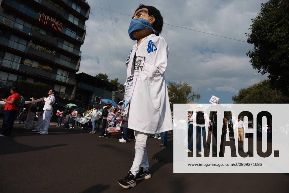 Thousands of healthcare workers hold national protest in Mexico City MEXICO CITY, MEXICO - OCTOBER 13: A healthcare worker mascot is seen during a national protest march demanding wage increases for healthcare workers and more medical supplies for Mexico s public health system, in Mexico City, Mexico on October 13, 2026. Thousands of members of the Mexican Social Security Institute (IMSS) marched to demand higher wages, improved working conditions, and action to address nationwide shortages of basic medicines and supplies across public hospitals. Daniel Cardenas Anadolu Mexico City Mexico. Editorial use only. Please get in touch for any other usage.