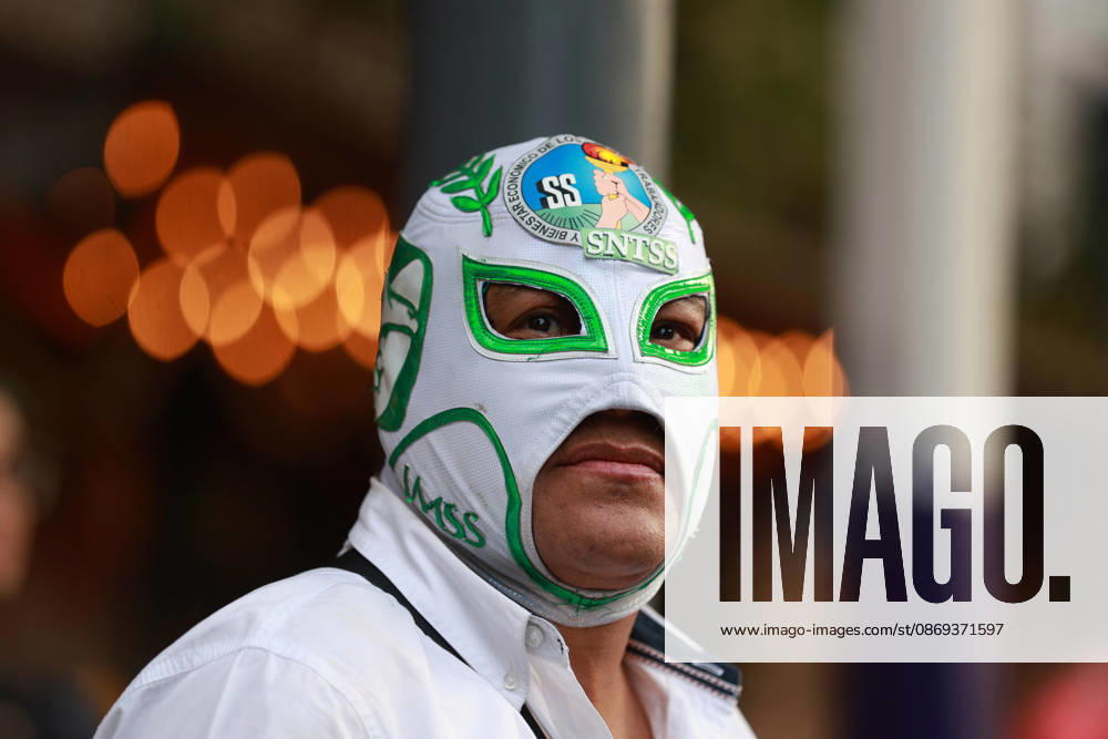 Thousands of healthcare workers hold national protest in Mexico City MEXICO CITY, MEXICO - OCTOBER 13: A masked man takes part in a national protest march demanding wage increases for healthcare workers and more medical supplies for Mexico s public health system, in Mexico City, Mexico on October 13, 2026. Thousands of members of the Mexican Social Security Institute (IMSS) marched to demand higher wages, improved working conditions, and action to address nationwide shortages of basic medicines and supplies across public hospitals. Daniel Cardenas Anadolu Mexico City Mexico. Editorial use only. Please get in touch for any other usage.