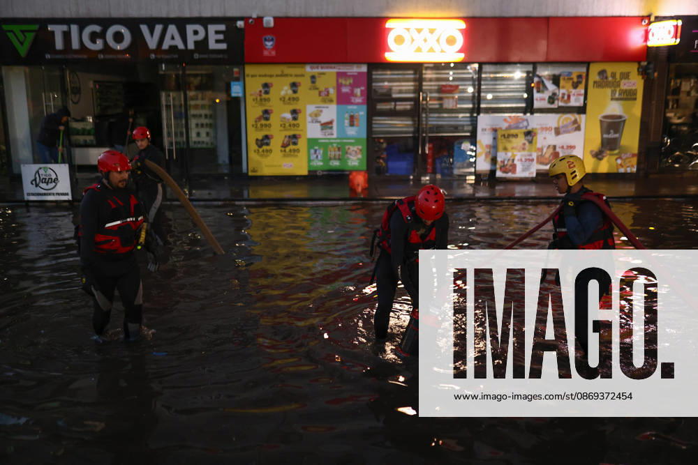 Chile declares a red alert in Santiago following heavy hailstorm SANTIAGO, CHILE - OCTOBER 13: Firefighters work to drain and assist in a parking lot submerged by floodwaters following heavy rains in Santiago, Chile, on October 13, 2026. The flash flooding inundated underground and open-air parking facilities, prompting local authorities to declare a red alert across the capital as emergency crews mobilized to handle severe waterlogging. Lucas Aguayo Araos Anadolu Santiago Chile. Editorial use only. Please get in touch for any other usage.