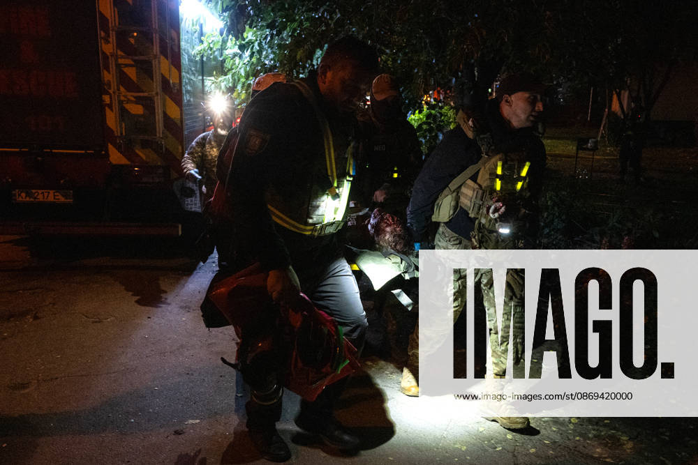 Rescuers carry on a stretcher a person injured in a Russian missile strike on a nine-story residential building in Kyiv’s Desnianskyi district, Ukraine, on October 14, 2026. Russia launched a massive ballistic missile attack on the capital. Three women were killed and 19 people were injured in the Desnianskyi district, including a seven-year-old girl. Apartments on the first through eighth floors of the building were also damaged (Photo by Danylo Antoniuk Ukrinform) Ballistic missile strikes next to nine-story residential building in Desnianskyi district of Kyiv