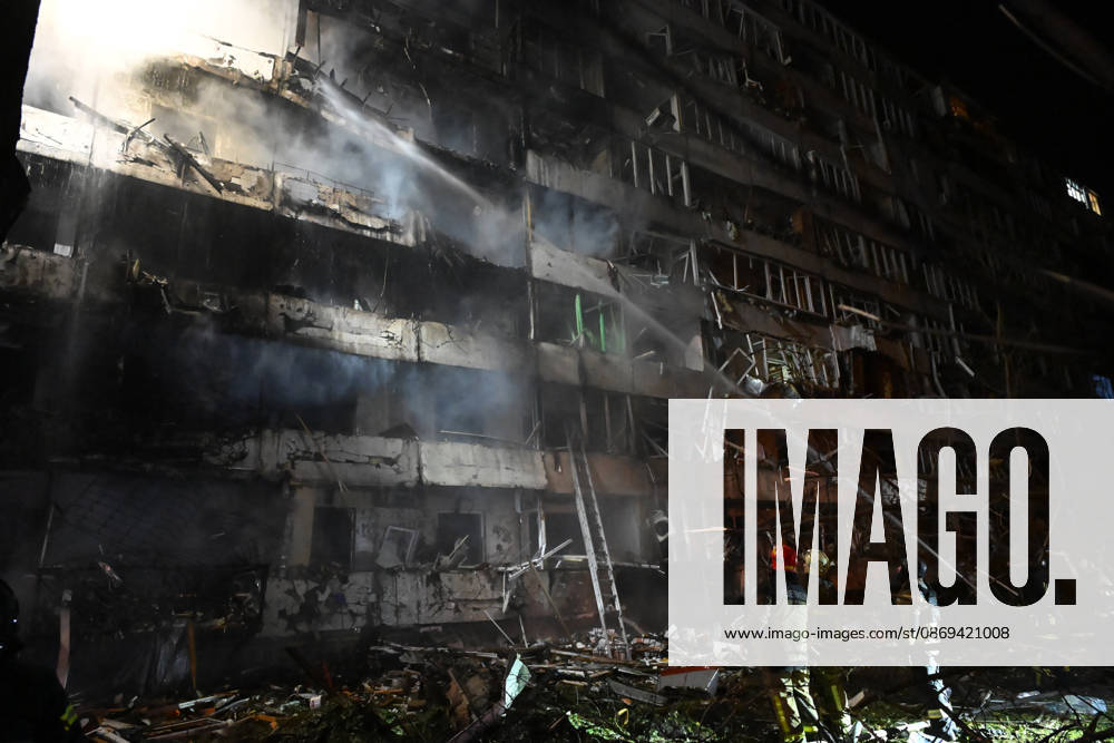 Ballistic missile strikes next to nine-story residential building in Desnianskyi district of Kyiv Rescuers extinguish a fire that broke out following a Russian missile strike on a nine-story residential building in Kyiv’s Desnianskyi district, Ukraine, on October 14, 2026. Russia launched a massive ballistic missile attack on the capital. Three women were killed and 19 people were injured in the Desnianskyi district, including a seven-year-old girl. Apartments on the first through eighth floors of the building were also damaged, Credit:Oleksandr Klymenko Ukrinform Avalon Ukraine, Kyiv