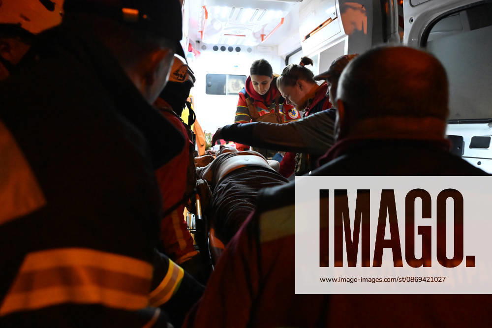 Ballistic missile strikes next to nine-story residential building in Desnianskyi district of Kyiv Medics provide assistance to a person injured in a Russian missile strike on a nine-story residential building in Kyiv’s Desnianskyi district, Ukraine, on October 14, 2026. Russia launched a massive ballistic missile attack on the capital. Three women were killed and 19 people were injured in the Desnianskyi district, including a seven-year-old girl. Apartments on the first through eighth floors of the building were also damage, Credit:Oleksandr Klymenko Ukrinform Avalon Ukraine, Kyiv