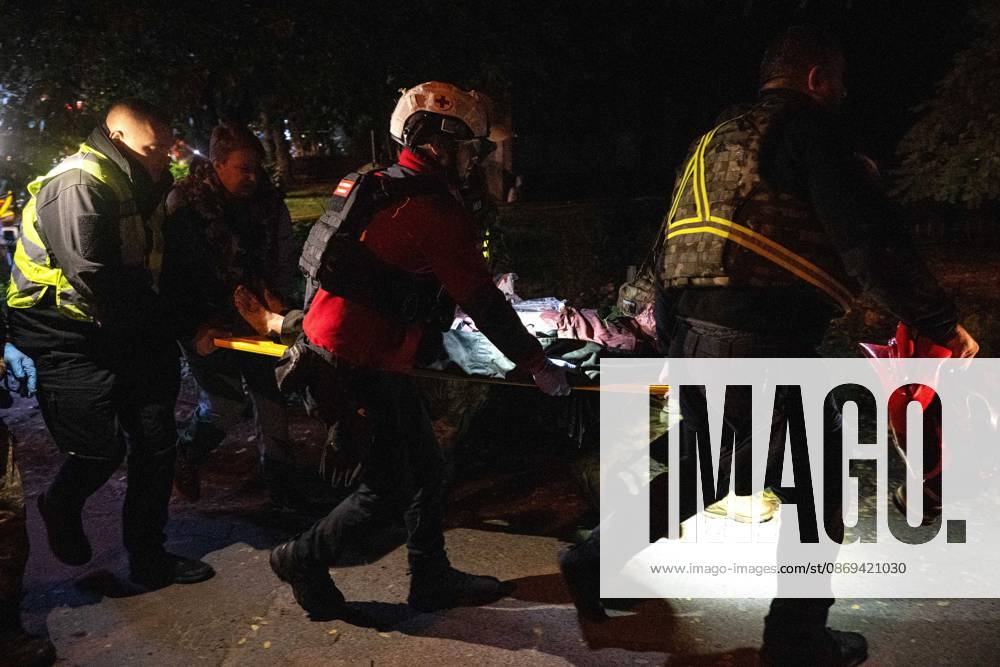 Ballistic missile strikes next to nine-story residential building in Desnianskyi district of Kyiv Rescuers carry an injured person on a stretcher after a Russian missile strike on a nine-story residential building in the Desnianskyi district of Kyiv, Ukraine, on October 14, 2026. Russia launched a massive ballistic missile attack on the capital. Three women were killed and 19 people were injured in the Desnianskyi district, including a seven-year-old girl. Apartments on the first through eighth floors of the building were also damaged, Credit:Danylo Antoniuk Ukrinform Avalon Ukraine, Kyiv