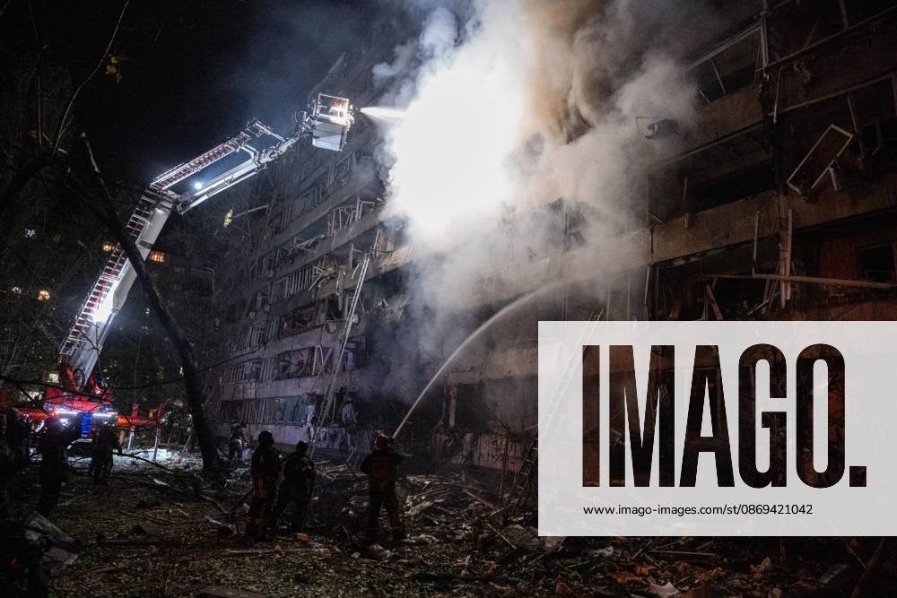 3 Dead and 19 Injured as Russian Missile Hits Residential Building - Kyiv A rescuer on an aerial platform extinguishes a fire that broke out following a Russian missile strike on a nine-story residential building in Kyiv? Desnianskyi district, Ukraine, on October 14, 2026. Russia launched a massive ballistic missile attack on the capital. Three women were killed and 19 other people were injured in the Desnianskyi district, including a seven-year-old girl. Apartments in the nine-story building were also damaged from the first through the eighth floor Photo by Danylo Antoniuk Ukrinform ABACAPRESS.COM Kyiv Ukraine
