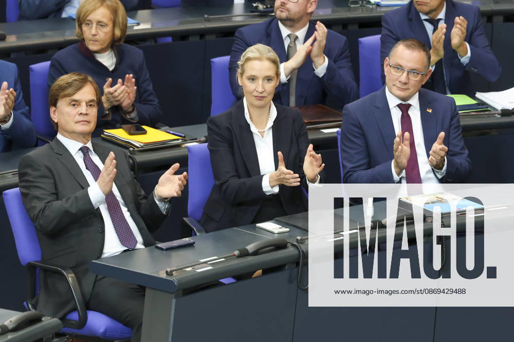Bernd Baumann, Alice Weidel, and Tino Chrupalla at the session of the German Bundestag on October 14, 2026, in Berlin; Chancellor Merz delivering the government’s policy statement to the German Bundestag