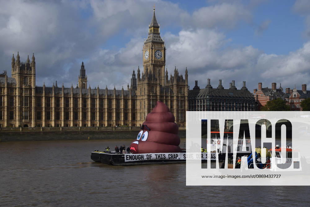 Campaigners inflate a giant ˜poo on the River Thames outside the Parliament, calling on the UK government to act on sewage pollution. London United Kingdom - ZUMAv130 20261014_zip_v130_001