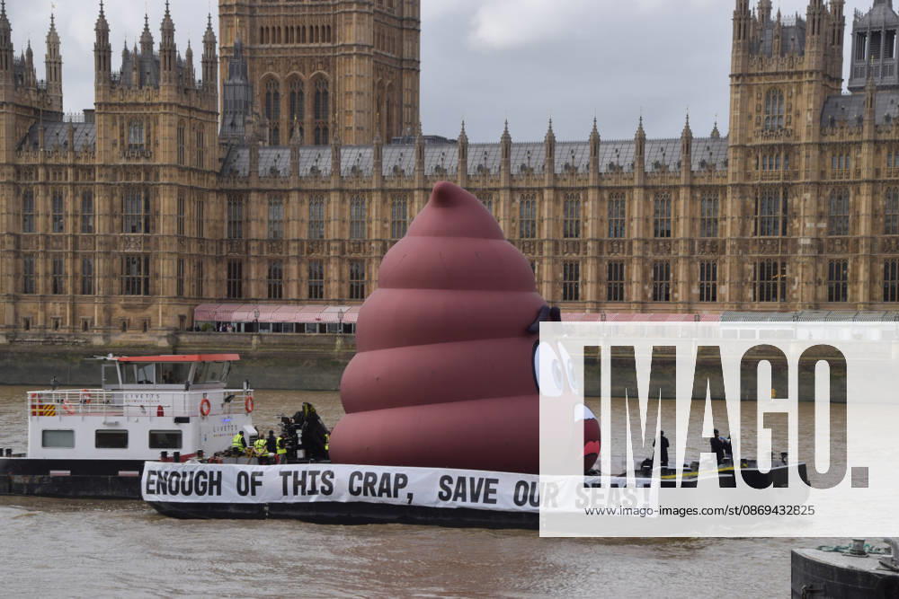 Campaigners inflate a giant ˜poo on the River Thames outside the Parliament, calling on the UK government to act on sewage pollution. London United Kingdom - ZUMAv130 20261014_zip_v130_006