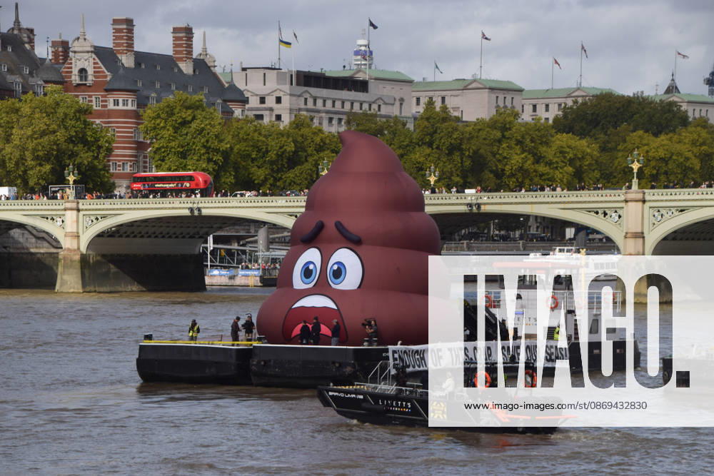 Campaigners inflate a giant ˜poo on the River Thames outside the Parliament, calling on the UK government to act on sewage pollution. London United Kingdom - ZUMAv130 20261014_zip_v130_007