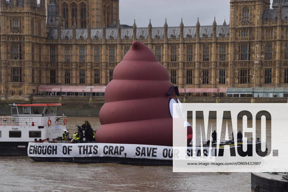 Campaigners inflate a giant ˜poo on the River Thames outside the Parliament, calling on the UK government to act on sewage pollution. London United Kingdom - ZUMAv130 20261014_zip_v130_009