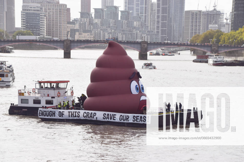 Campaigners inflate a giant ˜poo on the River Thames outside the Parliament, calling on the UK government to act on sewage pollution. London United Kingdom - ZUMAv130 20261014_zip_v130_010