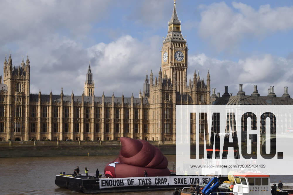 Campaigners inflate a giant ˜poo on the River Thames outside the Parliament, calling on the UK government to act on sewage pollution. London United Kingdom - ZUMAv130 20261014_zip_v130_021