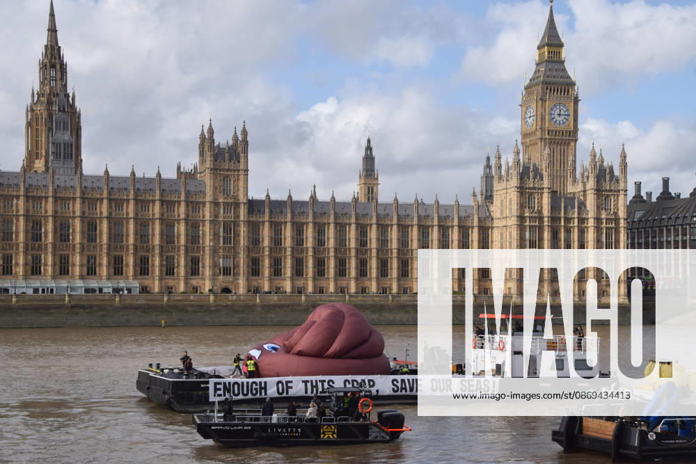 Campaigners inflate a giant ˜poo on the River Thames outside the Parliament, calling on the UK government to act on sewage pollution. London United Kingdom - ZUMAv130 20261014_zip_v130_022