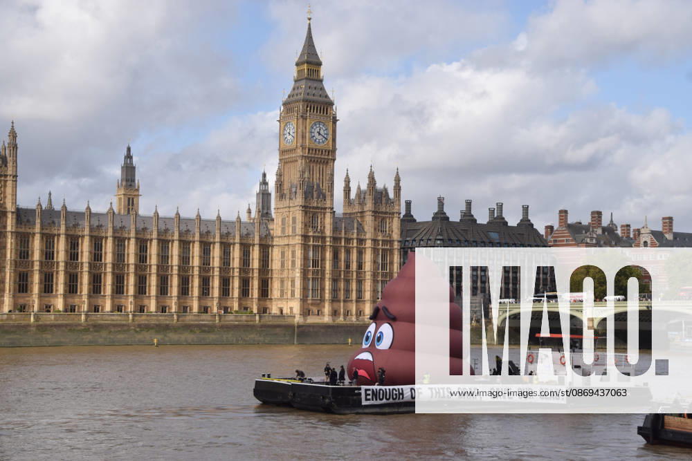 Campaigners inflate a giant ˜poo on the River Thames outside the Parliament, calling on the UK government to act on sewage pollution. London United Kingdom - ZUMAv130 20261014_zip_v130_026