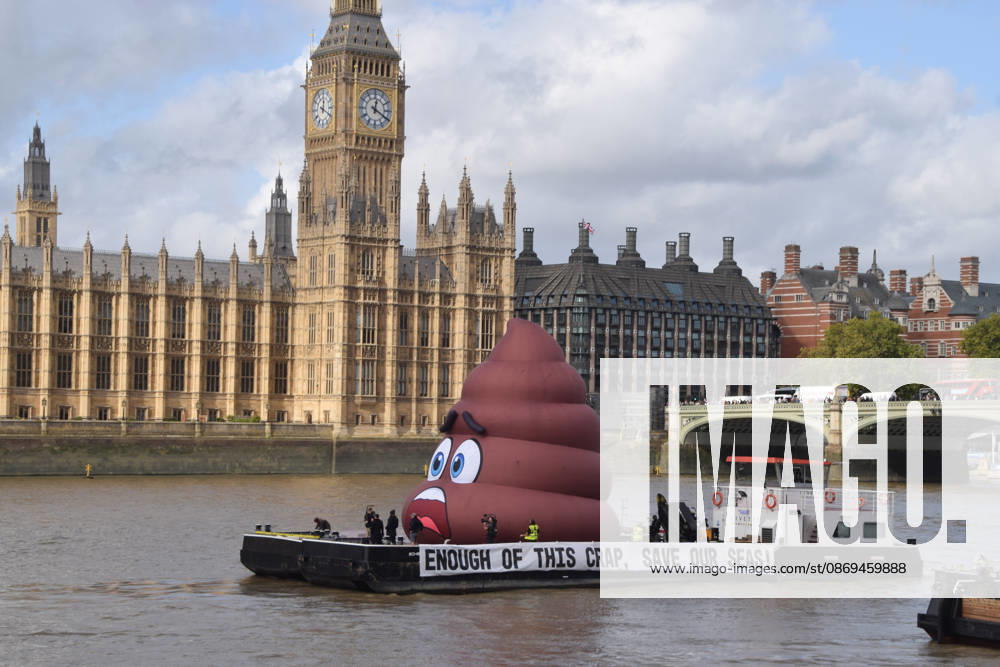 Campaigners inflate a giant poop emoji on the River Thames outside the Parliament, calling on the UK government to act on sewage pollution. London United Kingdom - ZUMAv130 20261014_zip_v130_027