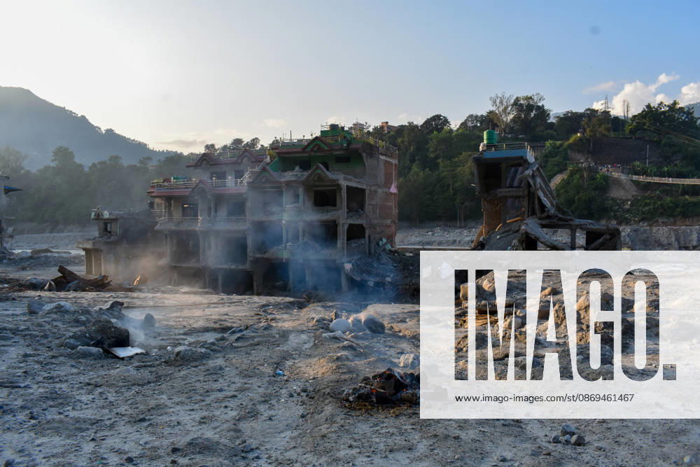 Aftermath of flash floods in Nepal NUWAKOT, NEPAL - OCTOBER 14 : Houses damaged by devastating flash floods are seen in Trishuli, Nuwakot district, Nepal on October 14, 2026. Road and pedestrian connectivity has been restored with the construction of a new suspension bridge over the Trishuli River, allowing local residents to cross the river after the devastating floods damaged bridges and other infrastructure in the area. Sunil Pradhan Anadolu Nuwakot Nepal. Editorial use only. Please get in touch for any other usage.