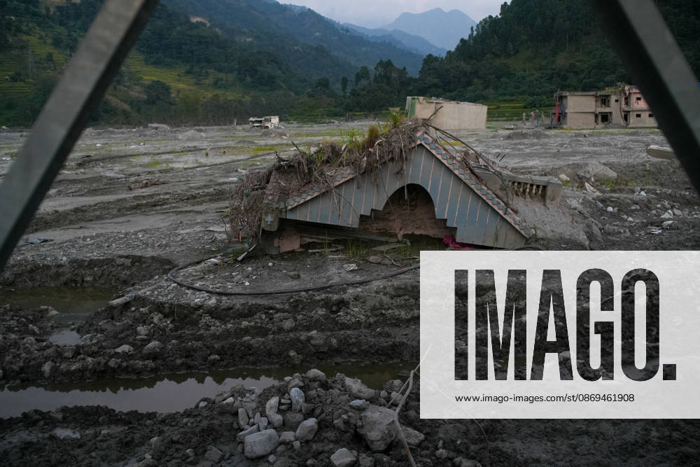 Aftermath of flash floods in Nepal NUWAKOT, NEPAL - OCTOBER 14 : Houses damaged by devastating flash floods are seen in Betrabati, Nuwakot district, Nepal on October 14, 2026. Road and pedestrian connectivity has been restored with the construction of a new suspension bridge over the Trishuli River, allowing local residents to cross the river after the devastating floods damaged bridges and other infrastructure in the area. Sunil Pradhan Anadolu Nuwakot Nepal. Editorial use only. Please get in touch for any other usage.