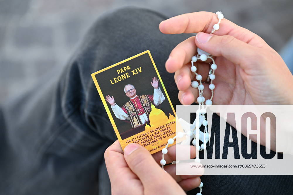 IPA89688196 - Italy, Rome, Vatican, October 14, 2026: A person prays near the statue of Pope John Paul II outside Agostino Gemelli University Hospital, where Pope Leo XIV is hospitalized, in Rome, Italy, on October 14, 2026. According to the Holy See Press Office, Pope Leo XIV is recovering after undergoing successful surgery on October 13 to remove the lower lobe of his right lung. Doctors confirmed a diagnosis of lung adenocarcinoma during the operation. Copyright Alessia Giuliani CPP
