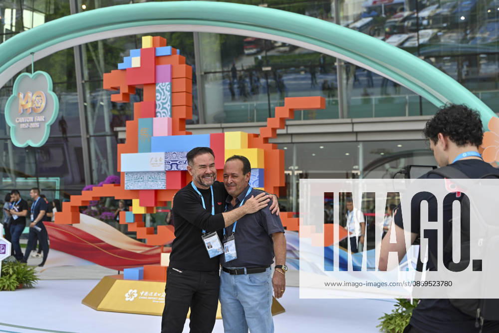 Overseas buyers pose for a photo outside the Canton Fair complex during the 140th China Import and Export Fair (Canton Fair) on October 15, 2026 in Guangzhou, Guangdong Province of China. The fair runs in three phases until November 4, covering a total exhibition area of 1.55 million square meters.
